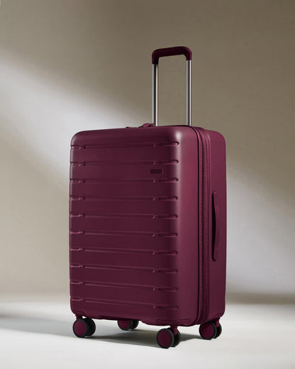 a purple suitcase with wheels